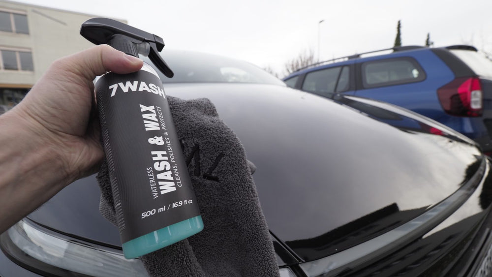 7WASH Waterless Wash & Wax spray and microfiber towel over a black car hood