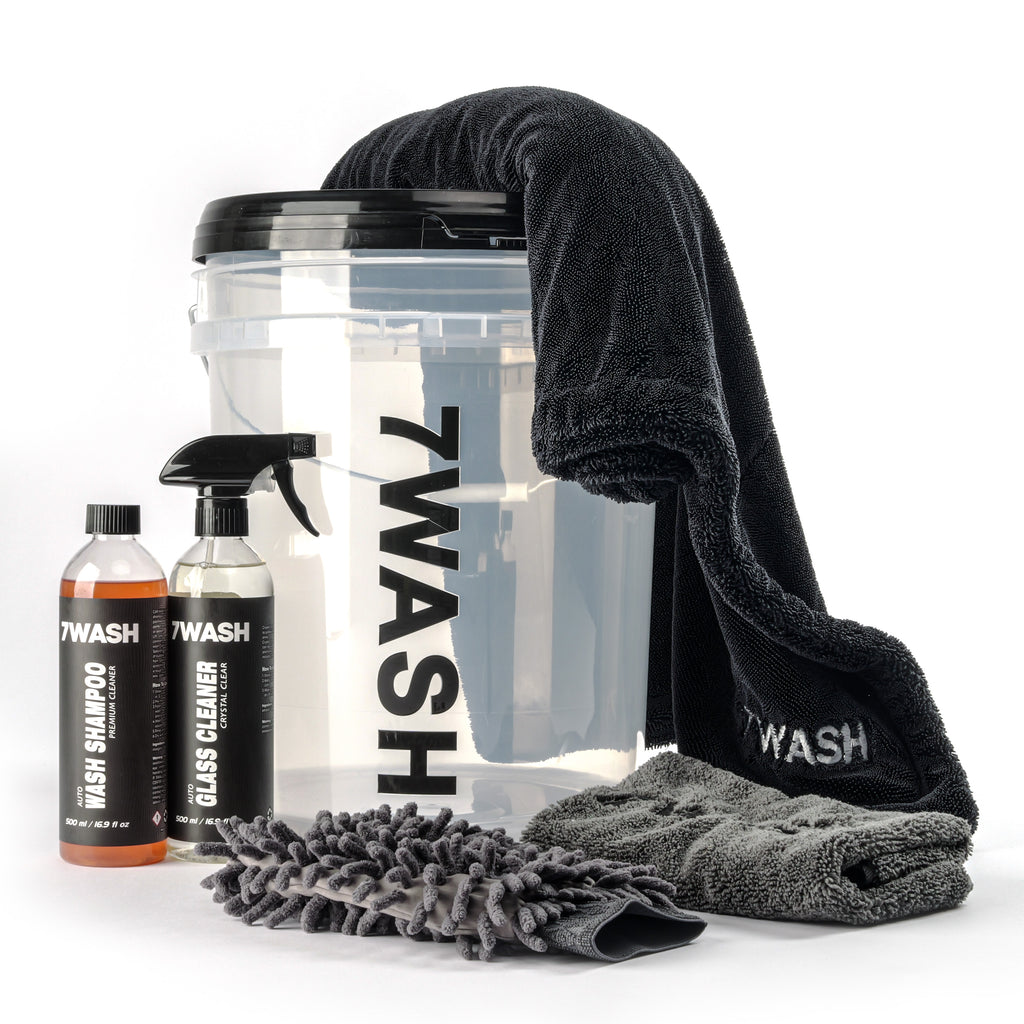 7WASH Basic Wash car care kit in a transparent 19L bucket including car shampoo, glass cleaner, microfiber wash mitt, plus a drying and buffing towel for paint and window cleaning.