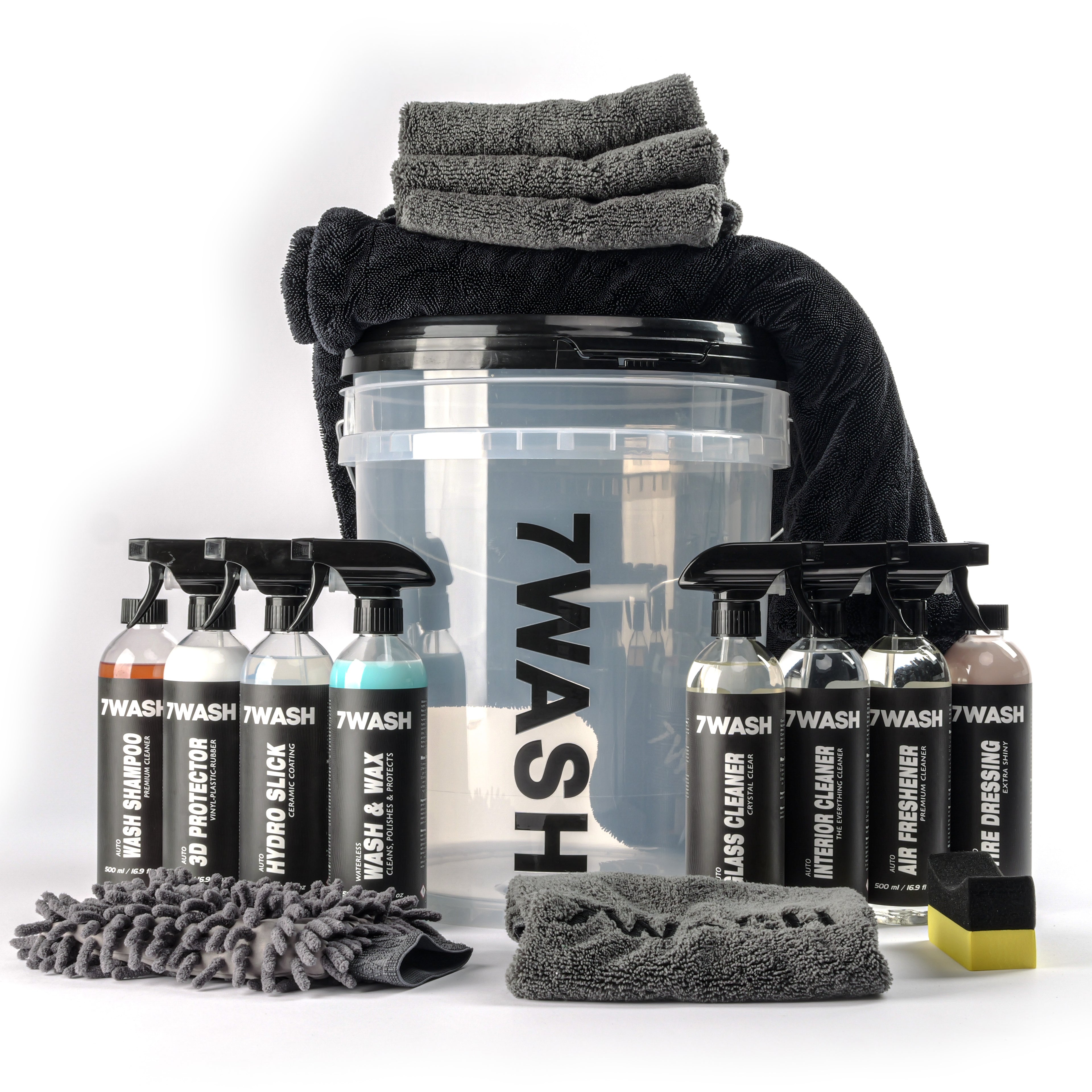 7WASH car detailing kit including a wash bucket, microfiber towels, wash mitt, foam applicator, and eight cleaning spray bottles featuring shampoo, wax, and interior cleaners.